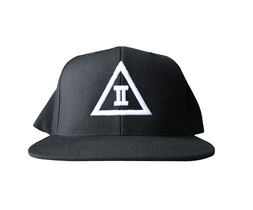 A black snapback hat with a 3D puff embroidered design on the front, featuring a white letter '2' on a green undervisor.